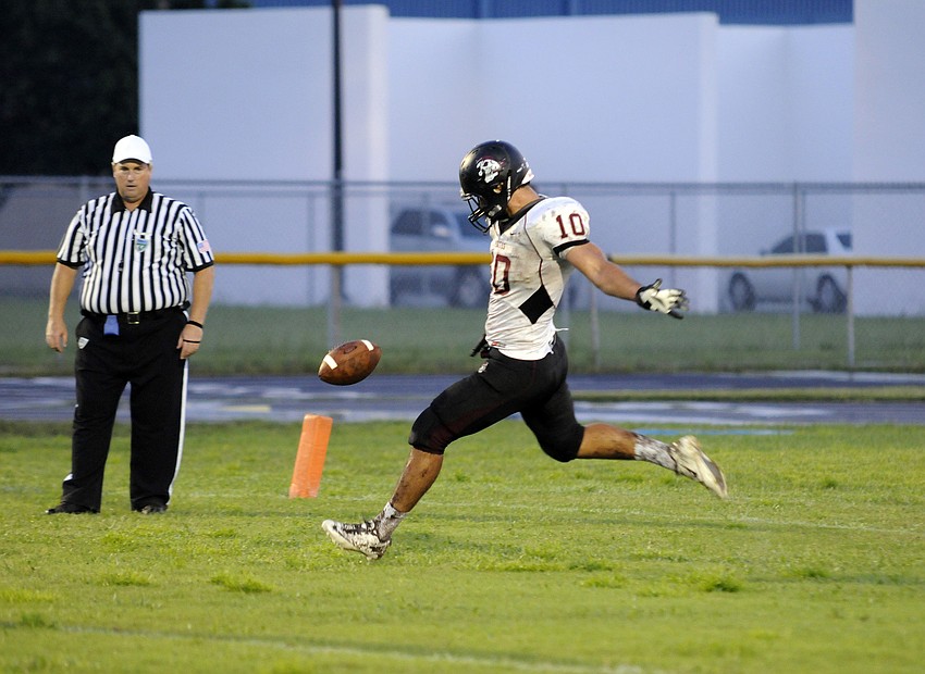 Senior Justin Rawlings punts the ball late in the second half.