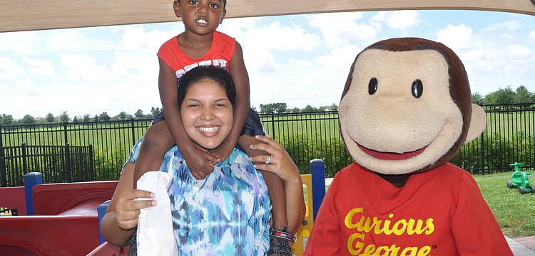 Jenelle and Xavier Omatseye hung out with Curious George.