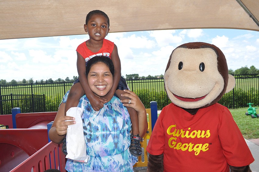 Jenelle and Xavier Omatseye hung out with Curious George.