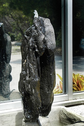 A 2.5-foot-tall bubbling fountain waterfall statue made of basaltic rock has been a part of the Longboat Island Chapel for many years. Church officials call the statue "irreplaceable."