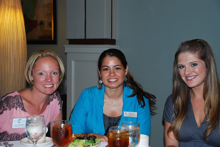 Blaire Green, Ashlyn Gueits and Nicole Stablein enjoy lunch and a lecture.