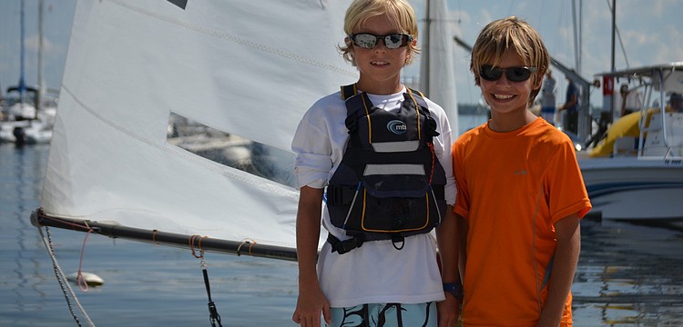 Bryce Tone and Justin Callahan get ready to hoist their sails at the 67th Annual Labor Day Regatta