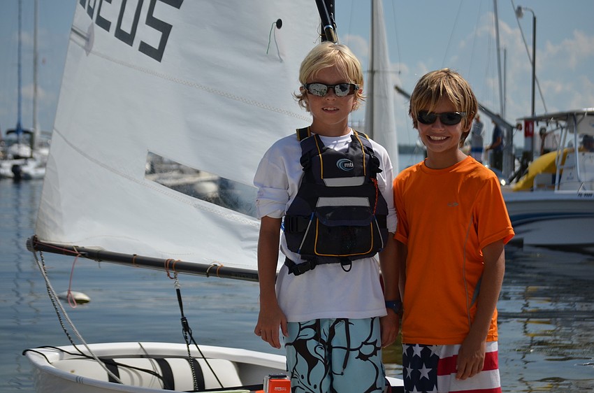 Bryce Tone and Justin Callahan get ready to hoist their sails at the 67th Annual Labor Day Regatta