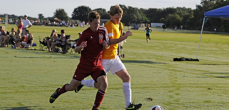 Tallahassee Unitedâ€™s Ian Hildebradnt and FC Sarasotaâ€™s Cameron Roscamp battle for possession.