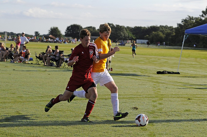 Tallahassee Unitedâ€™s Ian Hildebradnt and FC Sarasotaâ€™s Cameron Roscamp battle for possession.