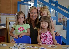 Allie M., Ashlyn Dobson, Lillian B. and Ella J. spend time at the math table.