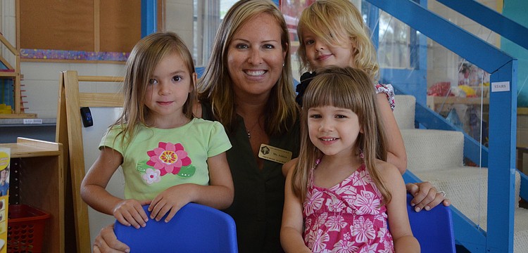 Allie M., Ashlyn Dobson, Lillian B. and Ella J. spend time at the math table.