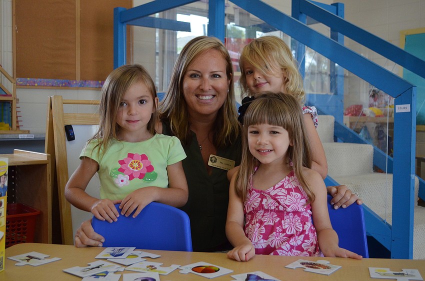 Allie M., Ashlyn Dobson, Lillian B. and Ella J. spend time at the math table.