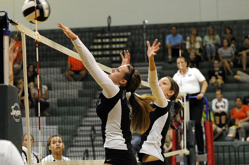 Lakewood Ranch senior Lauren Owen goes up for a block during the Lady Mustangs 3-0 victory over Sarasota Sept. 3.