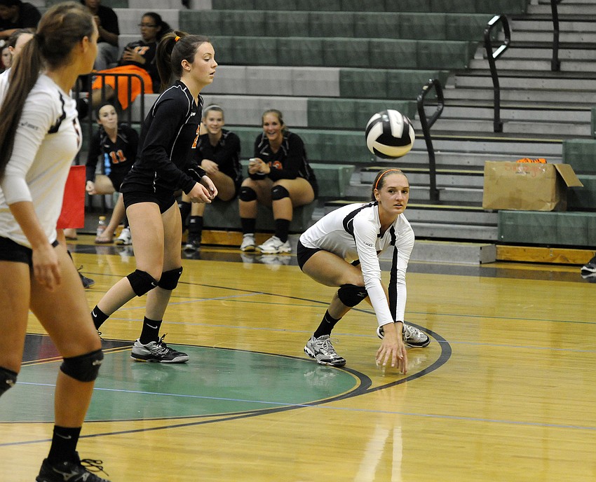 Sarasotaâ€™s Lauren Hochstetler digs the ball back to a teammate.