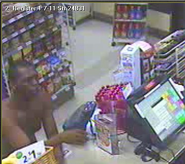 The shirtless suspect was acting suspicious in the store an hour before the incident, and the clerk thought he saw a gun in the man's clothing.