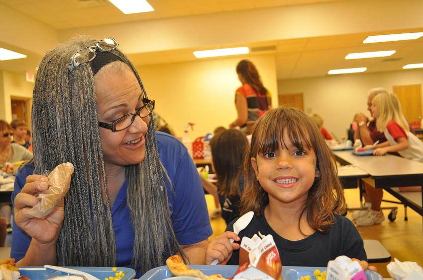 Kitty Brooks surprises her granddaughter, Jade Voorhees, with a cookie for dessert