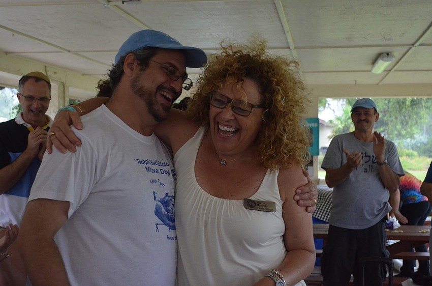 Hazzan Jeffrey Weber and Flora Oynick dance and laugh during the celebration.