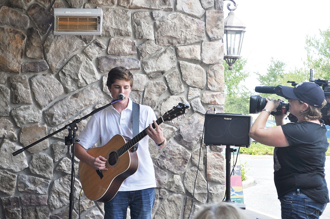 Sam Woolf, a Braden River High School student, performed Friday, Sept. 6, at MacAllisters on Lakewood Ranch Main Street. Photo by Harriet Sokmensuer.