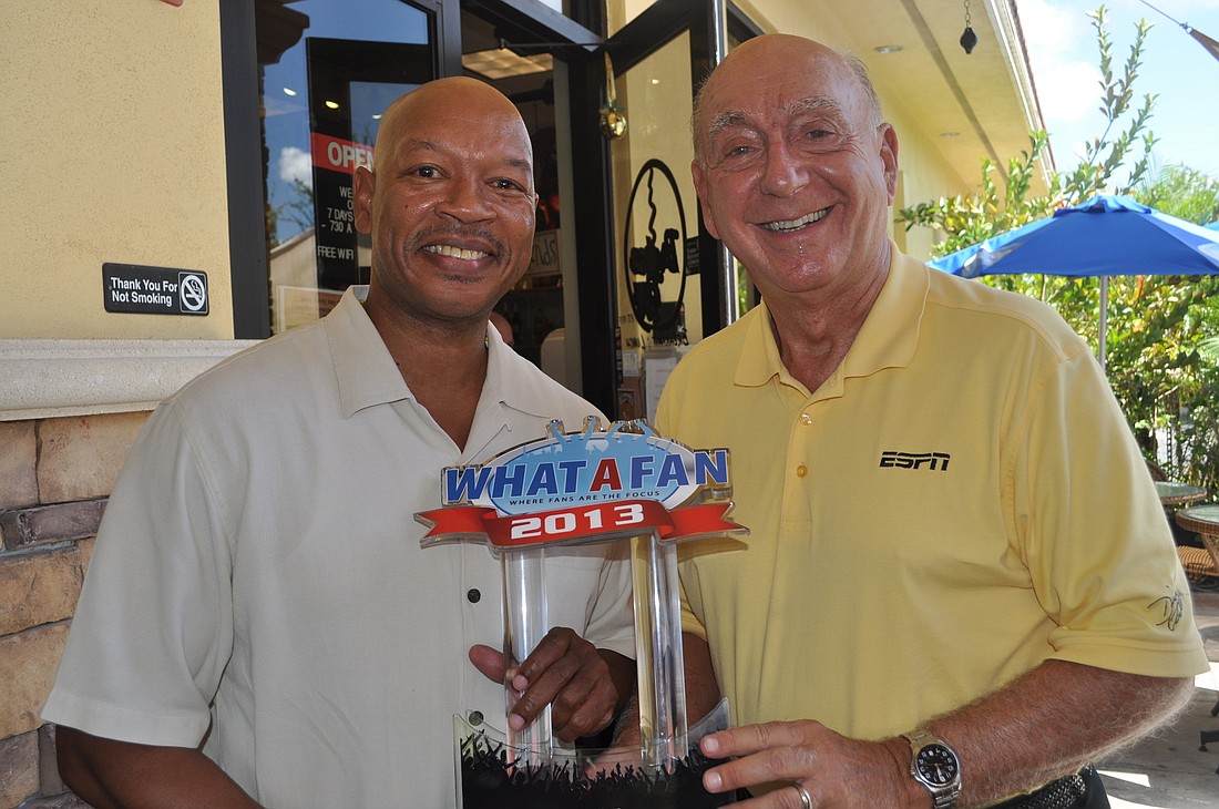Lowell Moore of What A Fan traveled from Orlando to present Dick Vitale with the first-annual Sports Icon Award at The Broken Egg Friday.