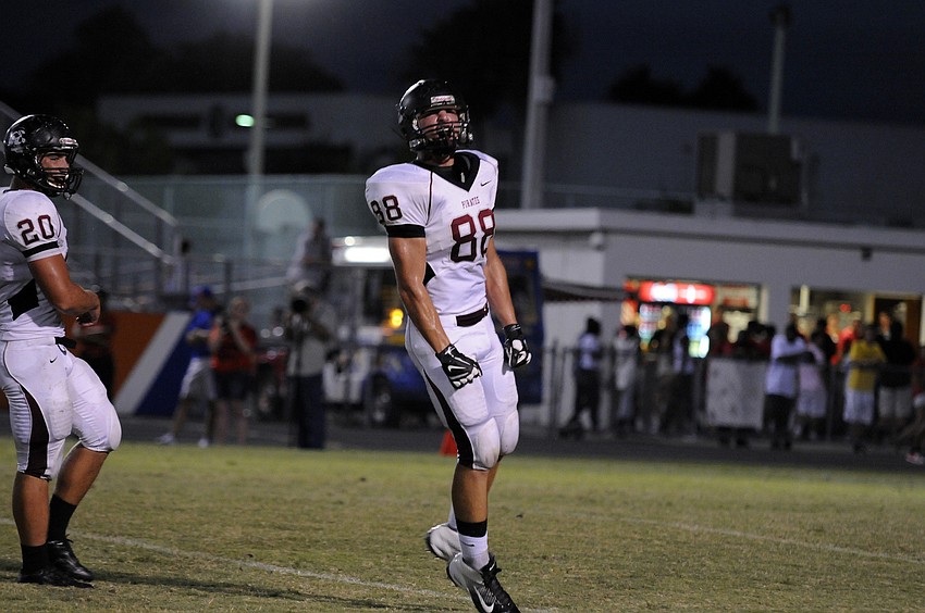 Braden River defensive end Derek Hinze celebrates after tackling a Southeast running back for a loss.