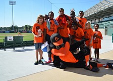 Oriole the Bird poses with some of the kids at the 2013 Walk for the Kids event.