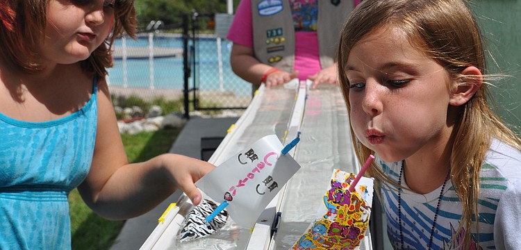 Courtney Carpenter and MaKenzie Vonborster competed against each other in Troop 736â€™s boat races