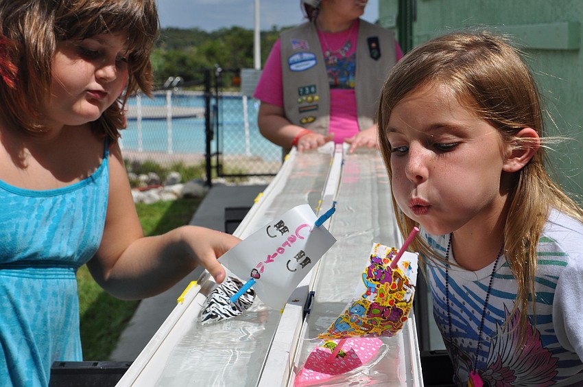 Courtney Carpenter and MaKenzie Vonborsten compete in Troop 736â€™s boat races.