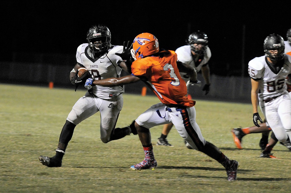 A Braden River running back attempts to elude Southeast defensive back Demarquis Brice.