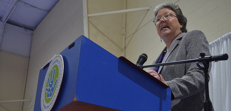 Executive Director of Community Youth Development Karen Bogues thanks community members for their support.