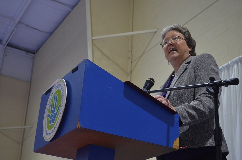 Executive Director of Community Youth Development Karen Bogues thanks community members for their support.