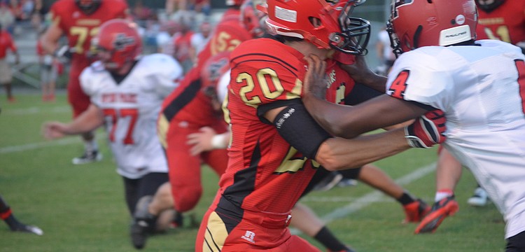Senior Eric Kreger blocks an Avon Park player during the game Friday night.