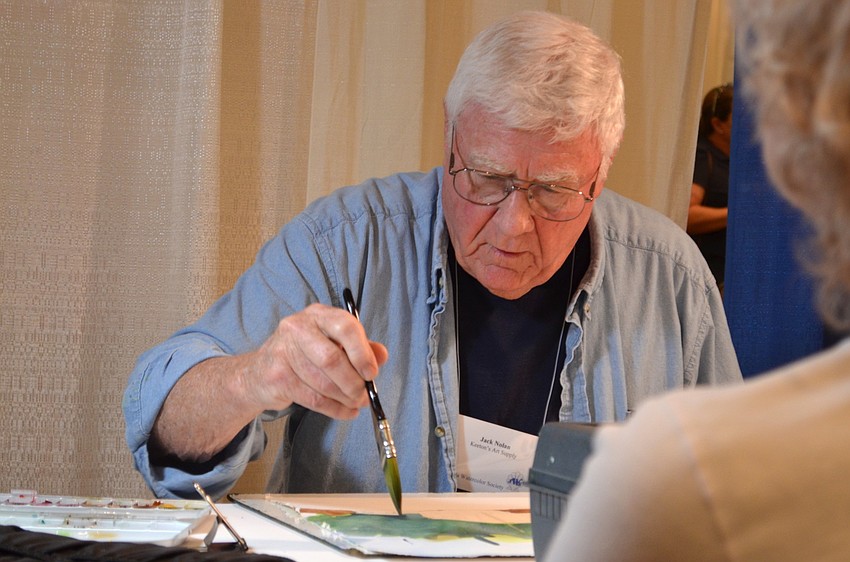 Longboat Key resident Jack Nolan demonstrates watercolor techniques for a captive audience