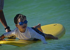 Adler McNesby, 5, waits to catch a wave.