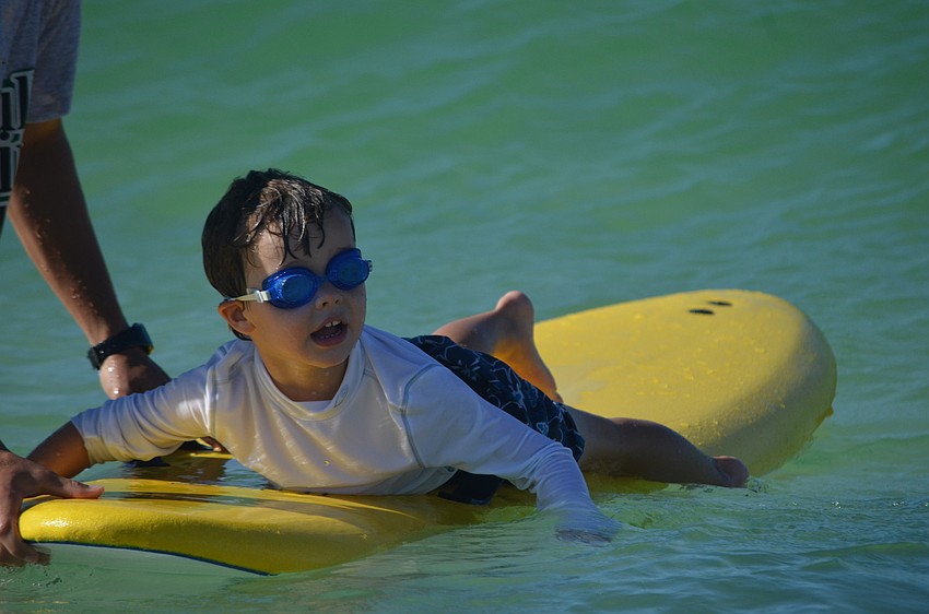 Adler McNesby, 5, waits to catch a wave.