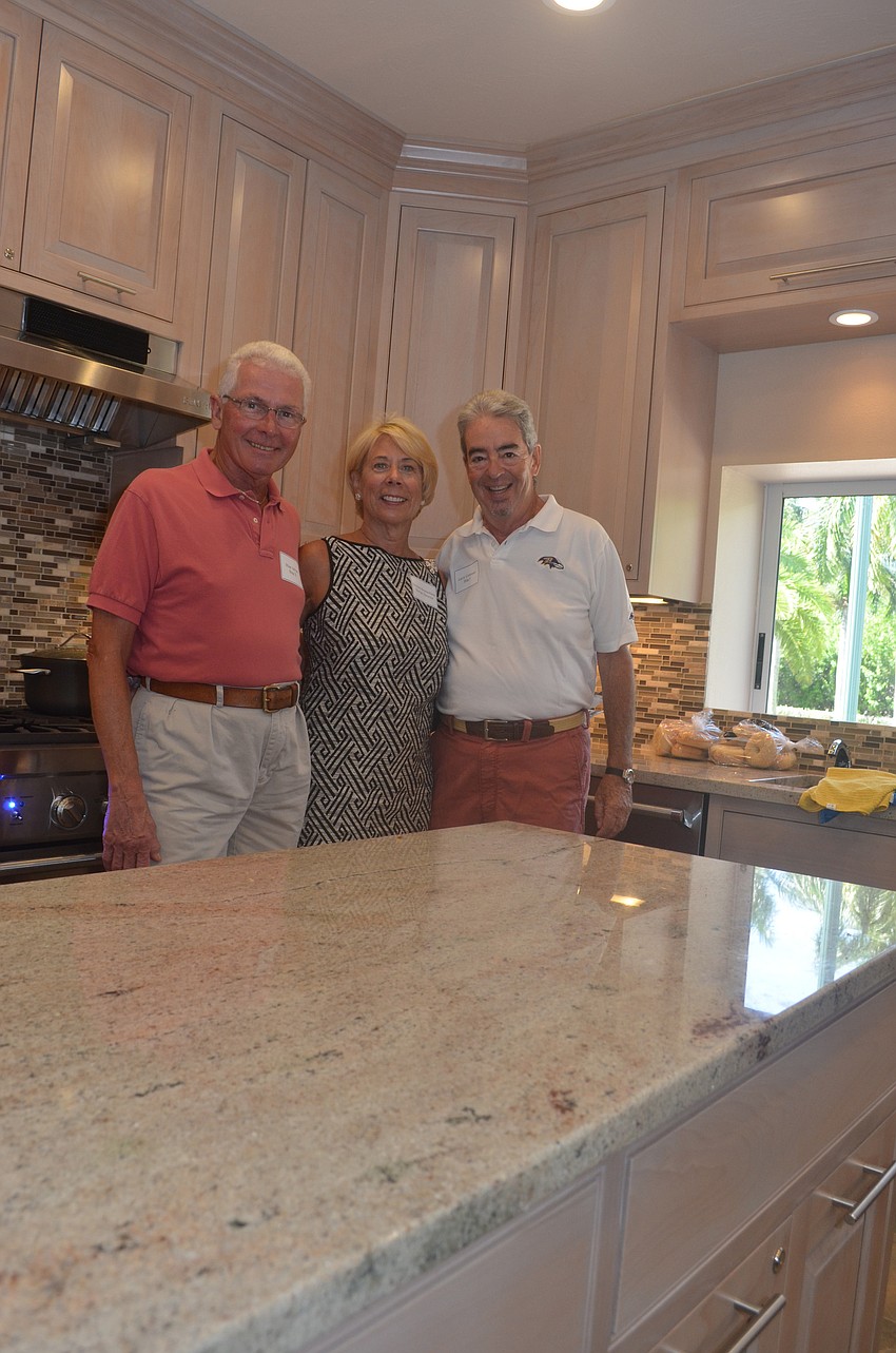 Milan Adrian, Donna Arenschield and Larry Coleman oversaw the construction, design and completion of the newly remodeled kitchen at the Grand Bay Club clubhouse.