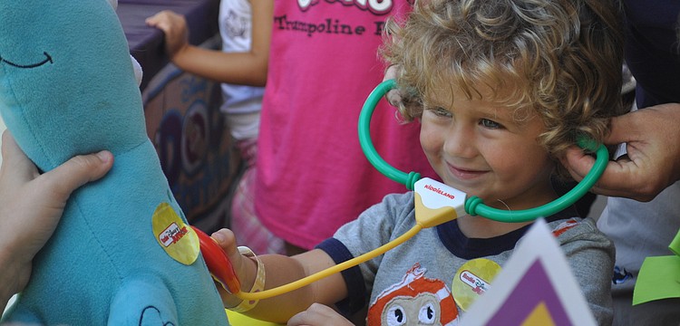 Hunter Montague listens closely to his friend, Dinorexâ€™s, heartbeat