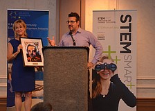Teri Hansen presents Jeff Hazelton with the STEM Smart Innovation Award.