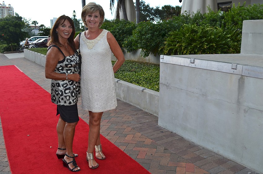 Pam Bernstein and Carol Fraser walk the red carpet from the library to The Sarasota Opera House to continue the celebration.