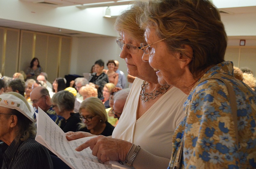 Brigitte Liltgureux and Ursula Pries rehearse Verdiâ€™s â€œVa, pensieroâ€ from Nabucco. Attendees were able to rehearse and learn the familiar score and participated in a group sing-a-long of the song at the end of the evening.