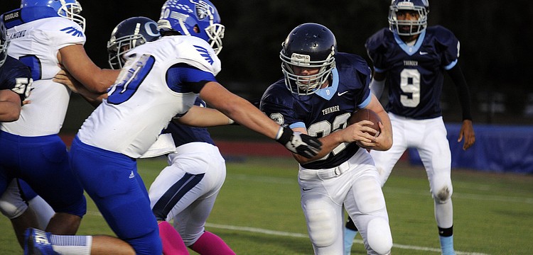 ODA sophomore running back Chris Poole carries the ball on the Thunderâ€™s opening possession.