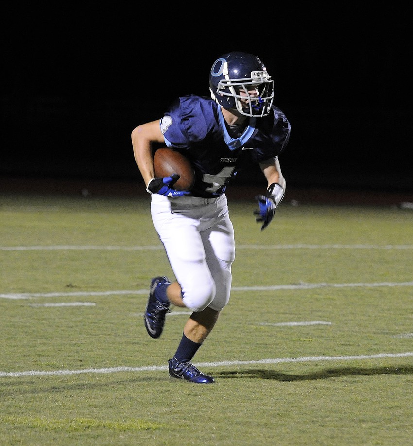 Senior Jeremy Herrin returns a kickoff in the first half.