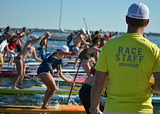 The 6.5 mile paddle board race begins.