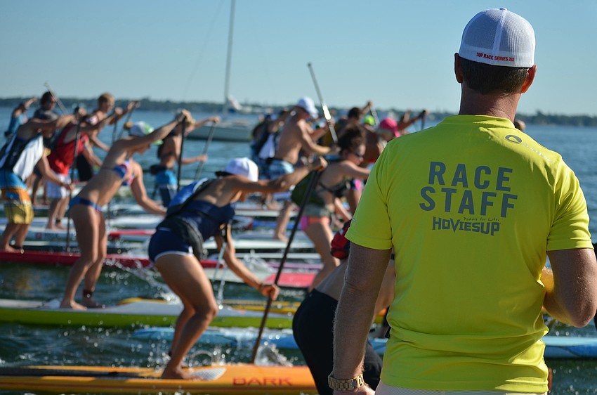 The 6.5 mile paddle board race begins.