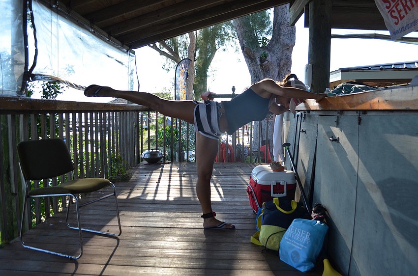 Francesca Morrow stretches before the race.