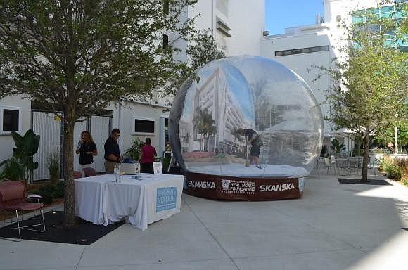 Community members visited the new SMH courtyard Sept. 7, and had their photograph taken in an inflatable snow globe.