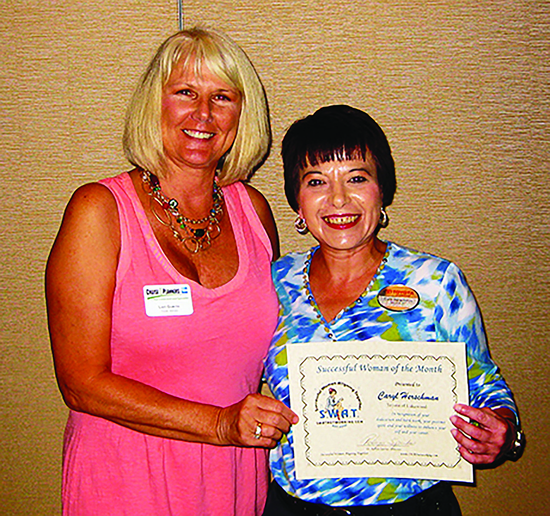 Lori Guerin presents Caryl Herschman with the award for Woman of the Month.