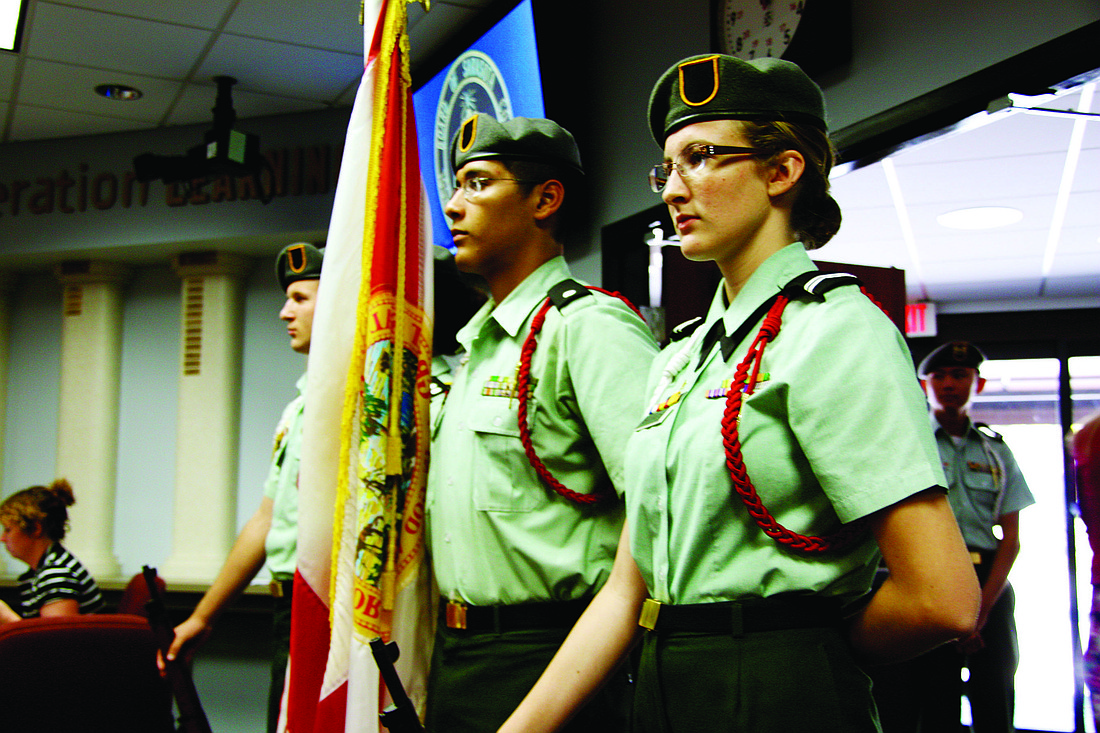 The Sarasota Military Academy Honor Guard stands at attention at TuesdayÃ¢â‚¬â„¢s School Board meeting.