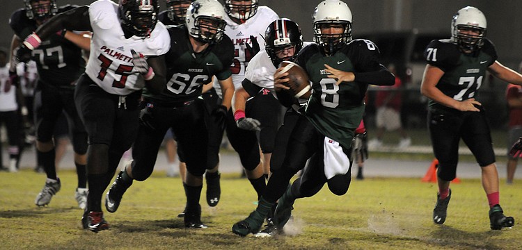 Lakewood Ranch High quarterback Chad Rex scrambles for yardage in the first half of the Mustangs district game versus Palmetto Oct. 18.