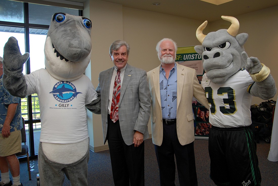 Mote mascot Gilly the Shark, Dr. Arthur Guilford, regional chancellor of USFSM, Dr. Michael Crosby, president and CEO of Mote, and USFSM mascot Rocky D. Bull. (Courtesy USF Sarasota-Manatee)