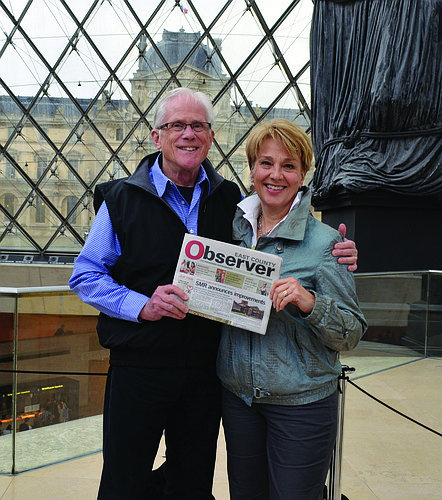 PARIS. Peter and Robin Miller recently took a trip to Europe. On the last day of their adventure, they stopped to catch up on their Observer news while exiting the Louvre.