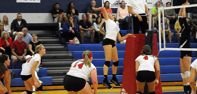 Cardinal Mooney freshman Madison McNally goes up for a kill during the Cougars district semifinal match versus Bradenton Christian.