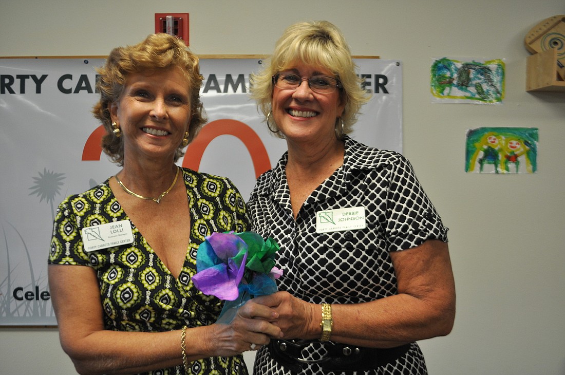 Jean Lolli and Debby Johnson were recognized for their years of service at Forty Carrots.
