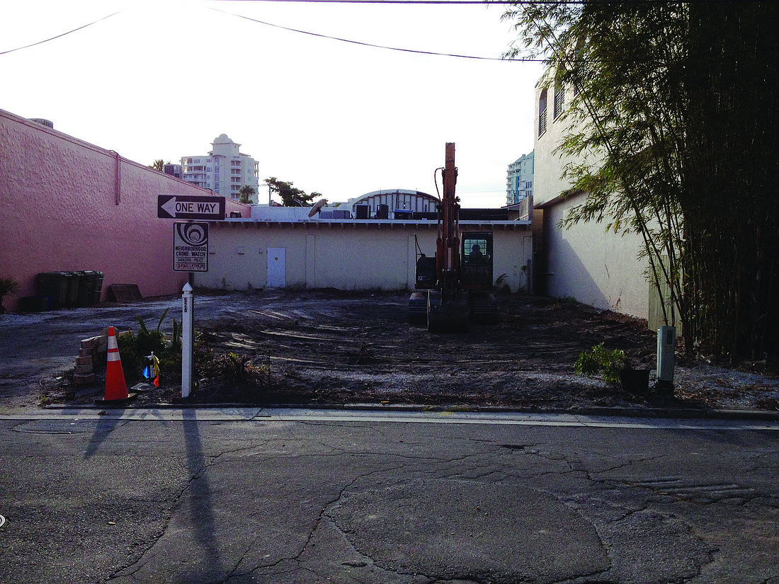 Construction crews demolished a historic building abutting Laurel Park this month for the proposed expansion of a philanthropic consignment shop.