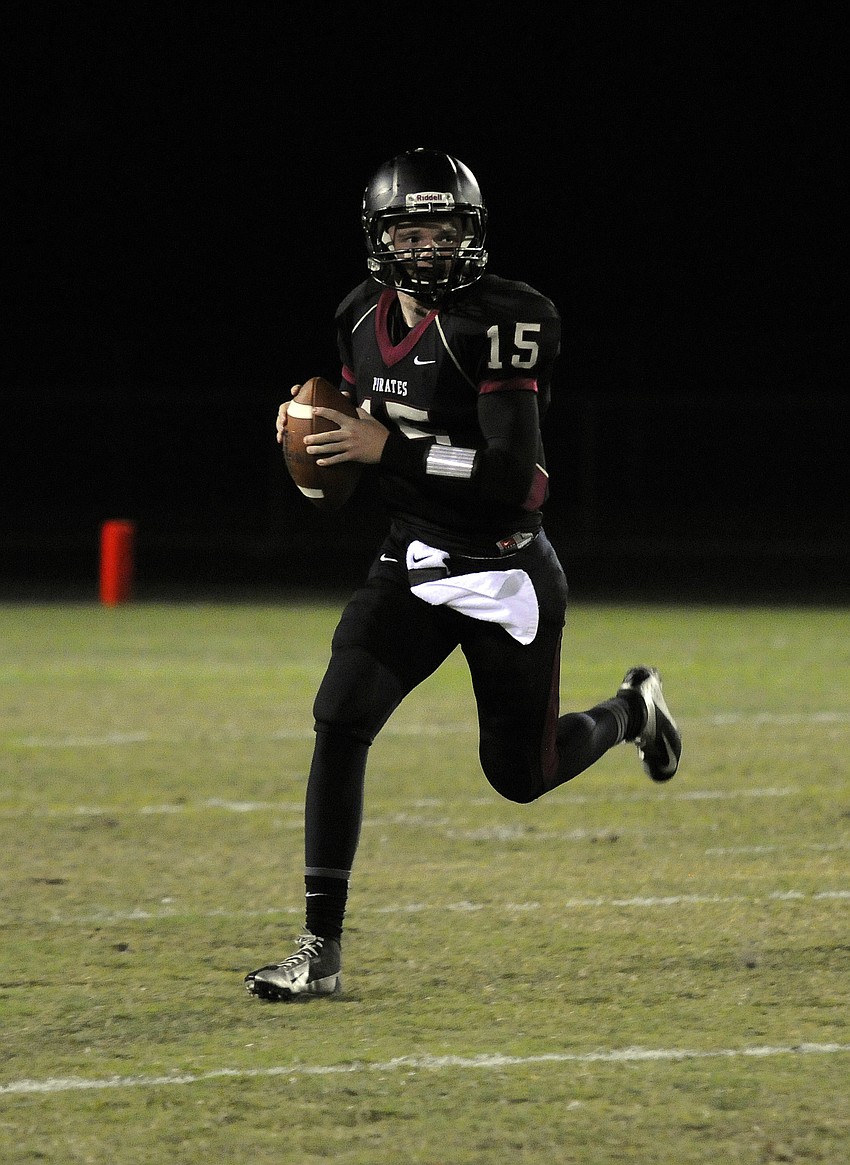 Quarterback Dusty Peebles drops back to pass during the Pirates opening possession of the third quarter.